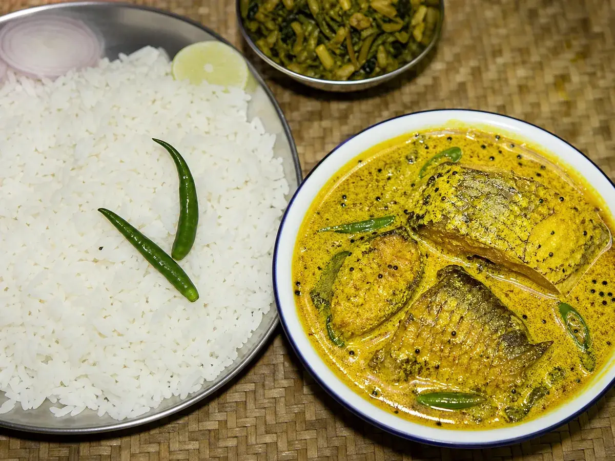 Home-cooked Bengali fish curry with steamed rice from a verified home chef, home food delivery